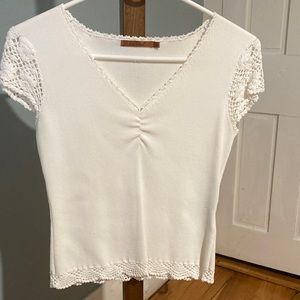 Pretty little white v-neck sweater/top with delicate enhancing details.